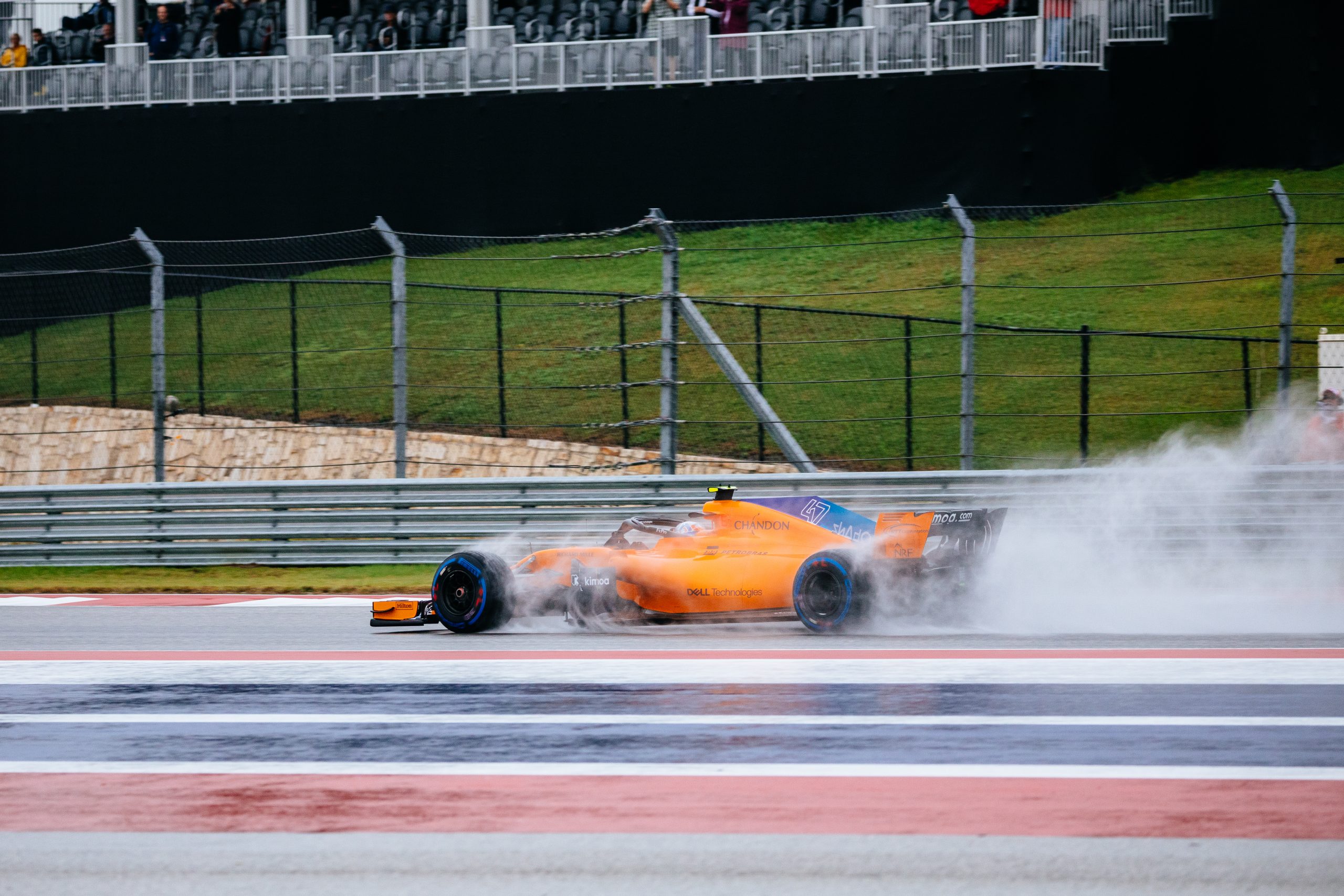 Driver Lando Norris putting his McLaren through the paces in a very wet FP1 session. Lando will be driving full-time for McLaren for the 2019 season.