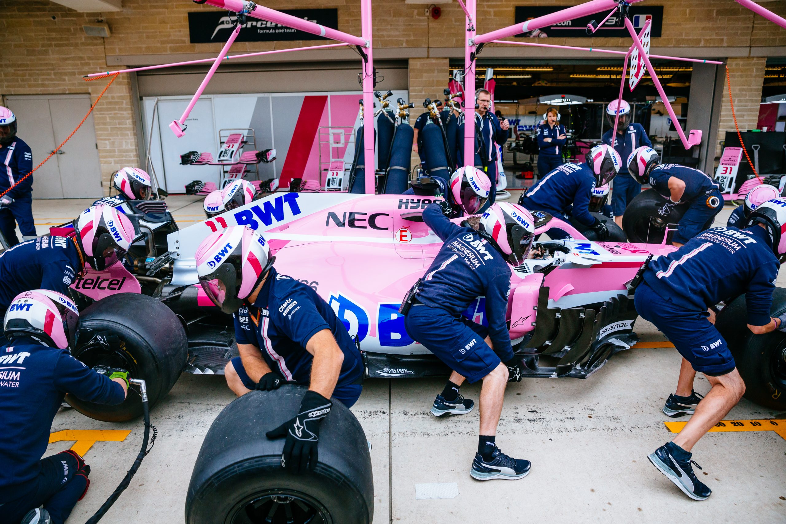 Prior to the start of FP3, the team performs several repetitions of pit stop practice by rolling the car into the pit box and performing different tasks like changing the tires. This practice is what helps them do pitstops in under three seconds on a regular basis.