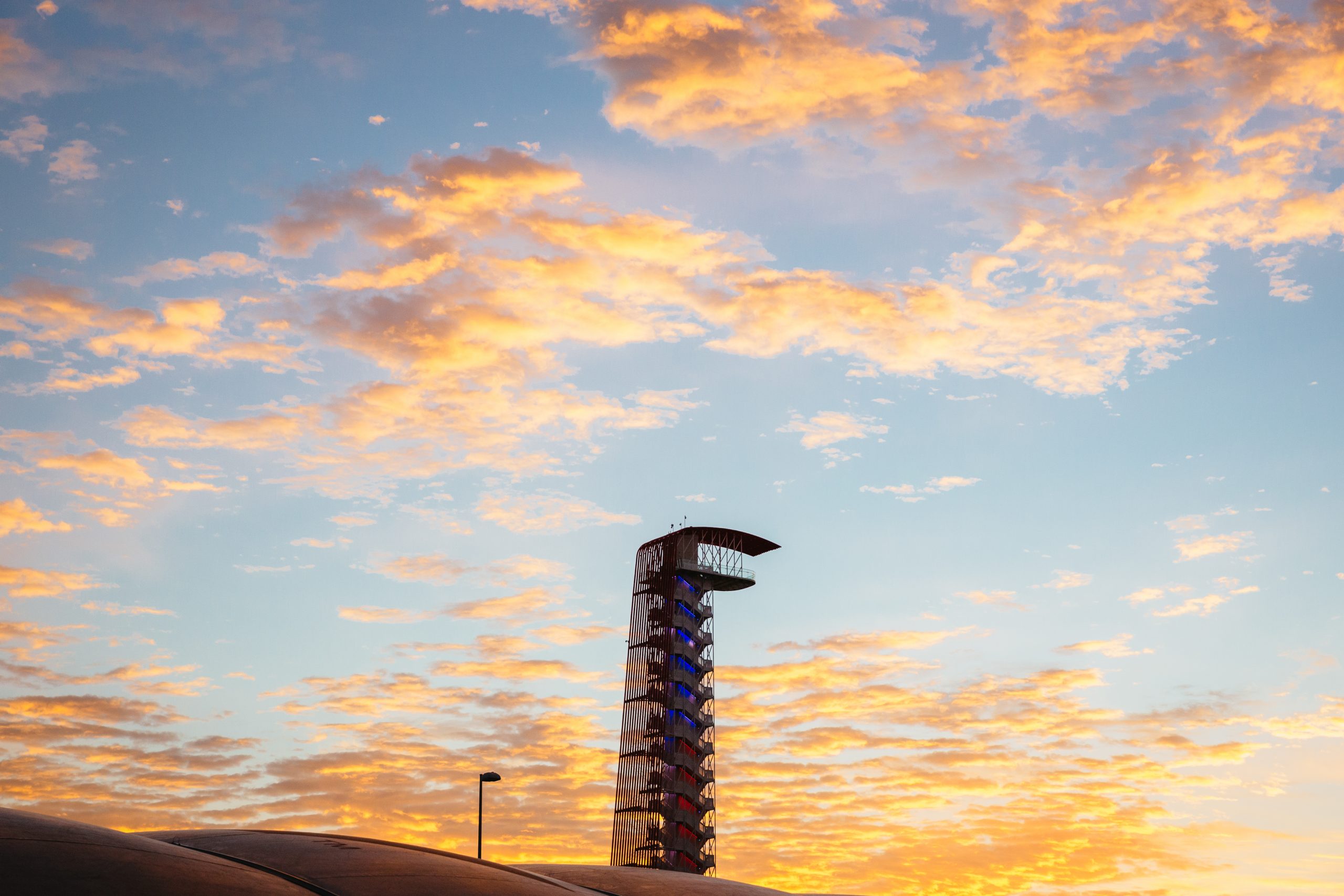 The iconic COTA Tower at sunrise on race day. Just because this is a motorsport event doesn't mean you can have a typical Texas Highways landscape.