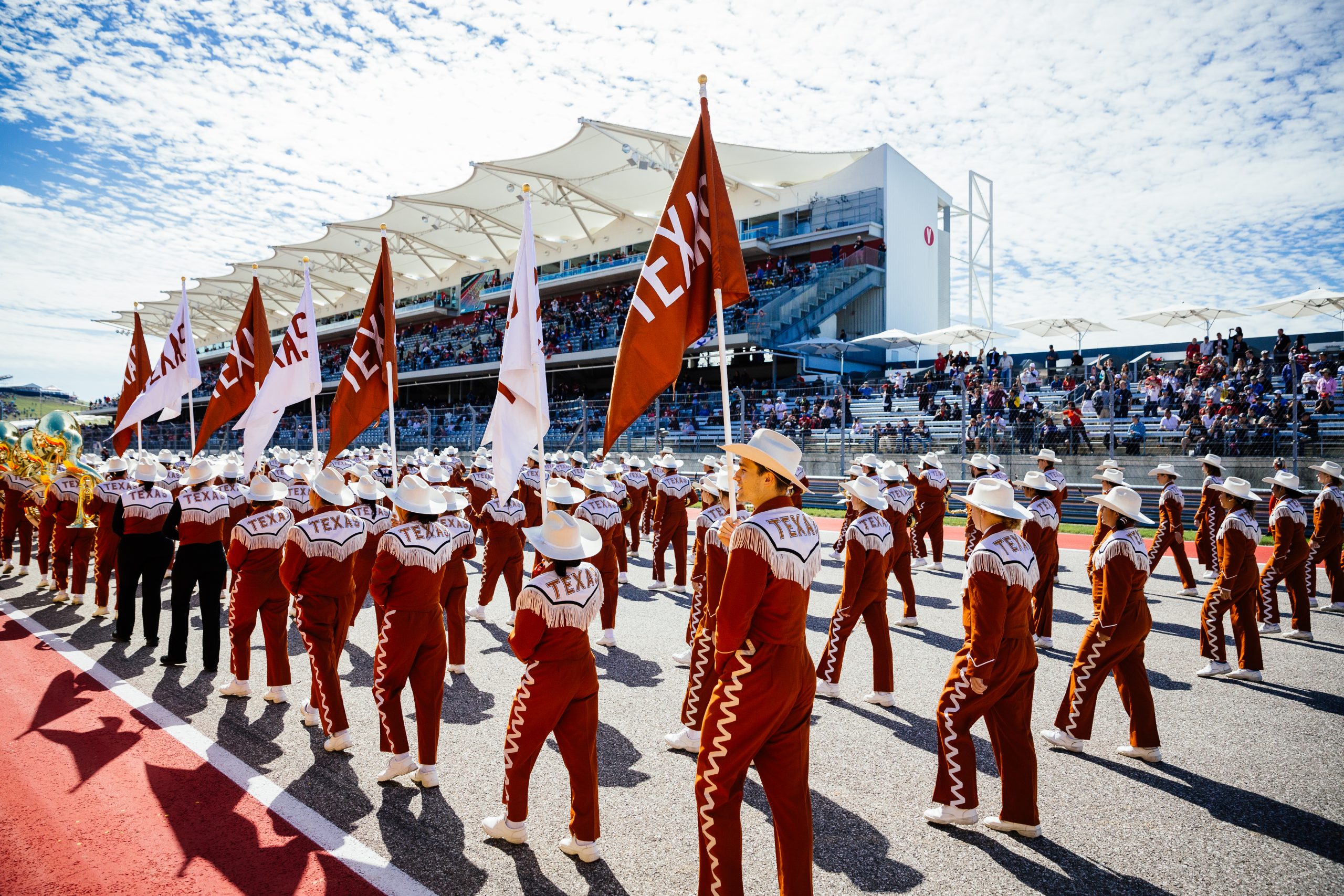 The University of Texas Longhorn Show Band performing on track prior to the race.