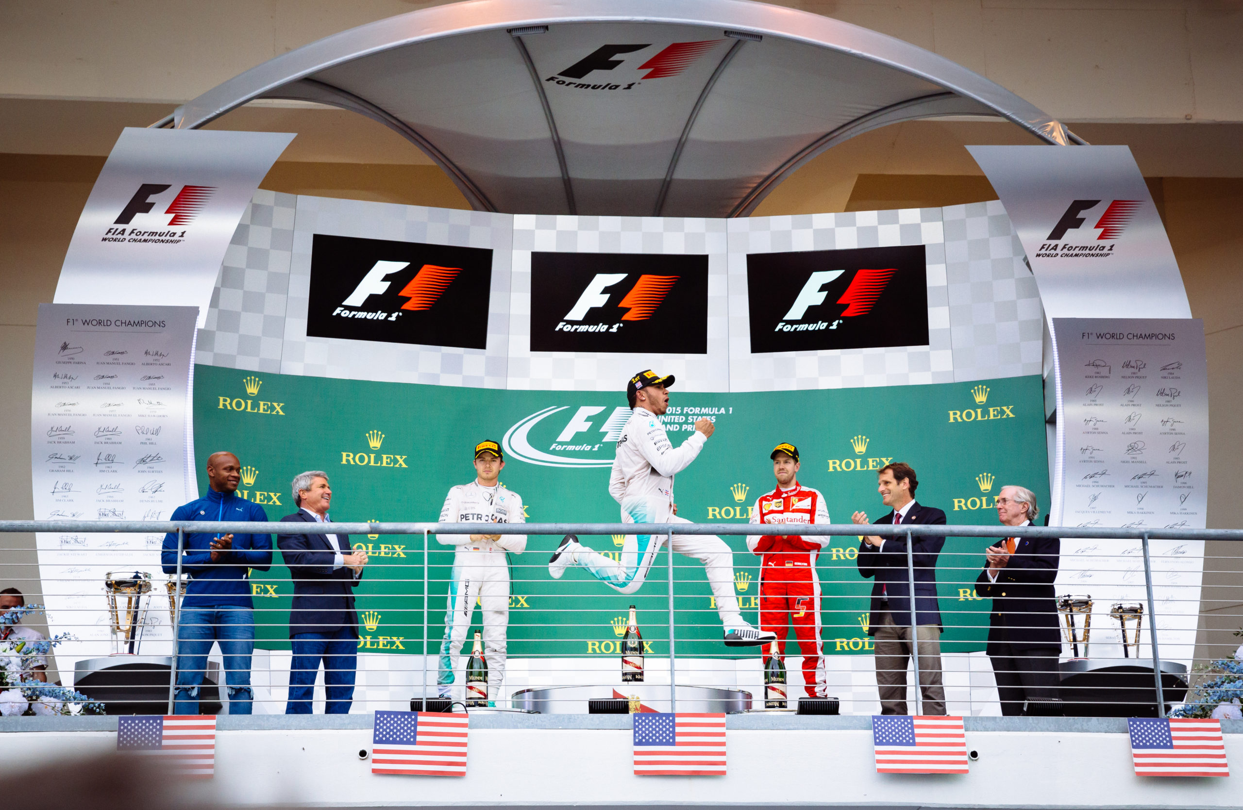 Lewis Hamilton celebrates his race win at the 2015 United States Grand Prix which secured his 5th Drivers' championship.